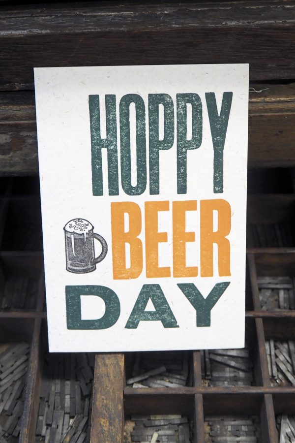 Hoppy Beer Day - Letterpress Birthday Card. Hand made letterpress birthday card, printed in orange and green on 100% recycled card using original wooden poster type.