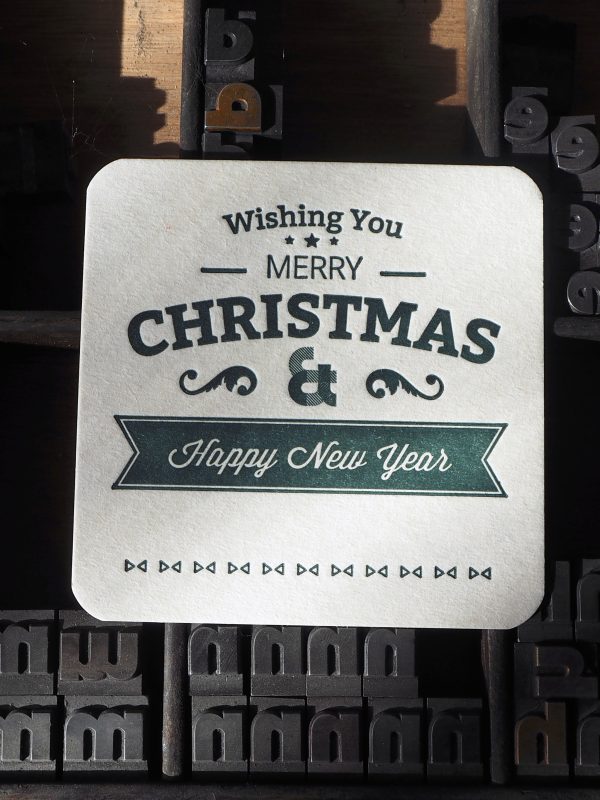 Letterpress Christmas Coaster. Hand printed in green on a vintage letterpress machine.